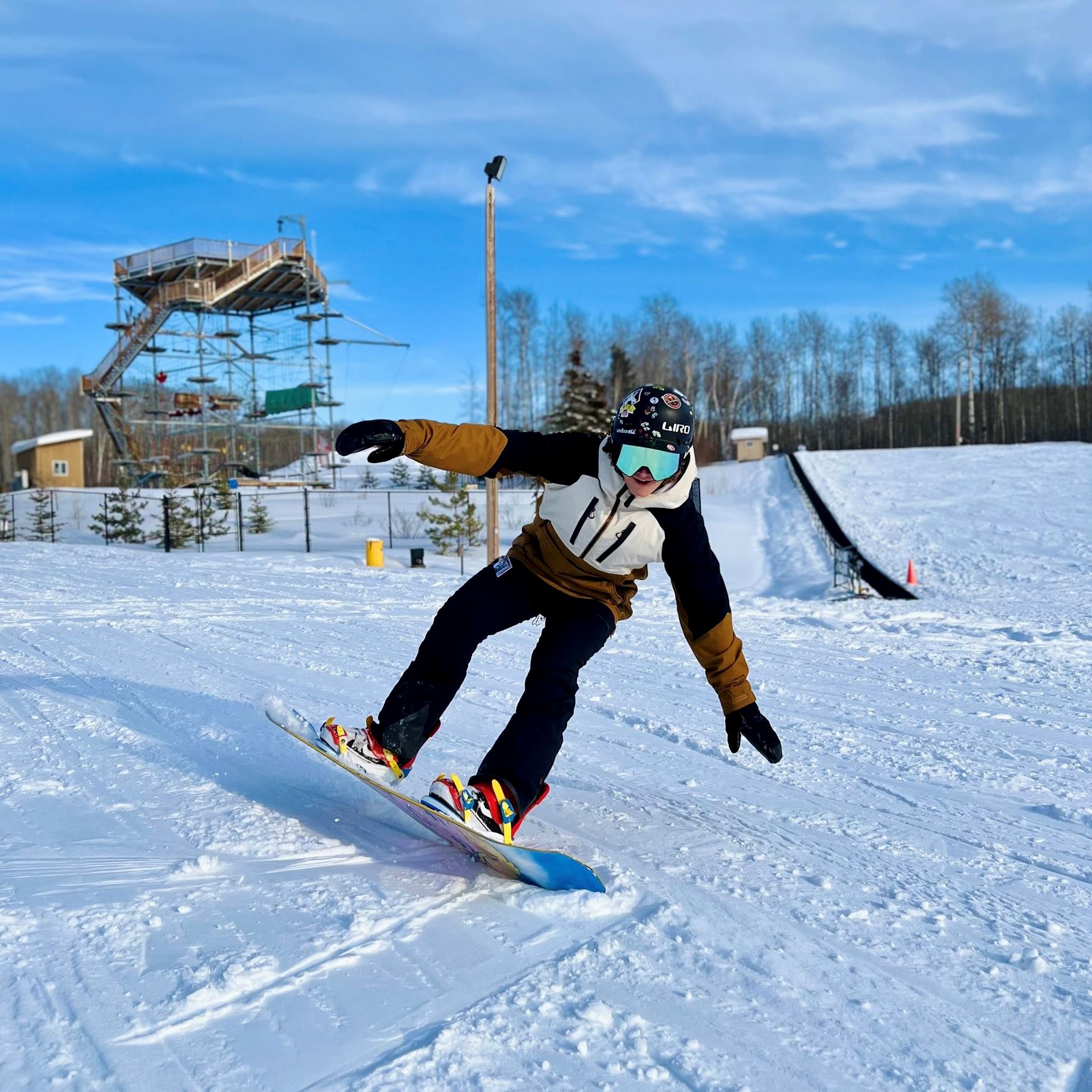 Winter operations at Kinosoo Ridge — snow-covered slopes and running chairlift